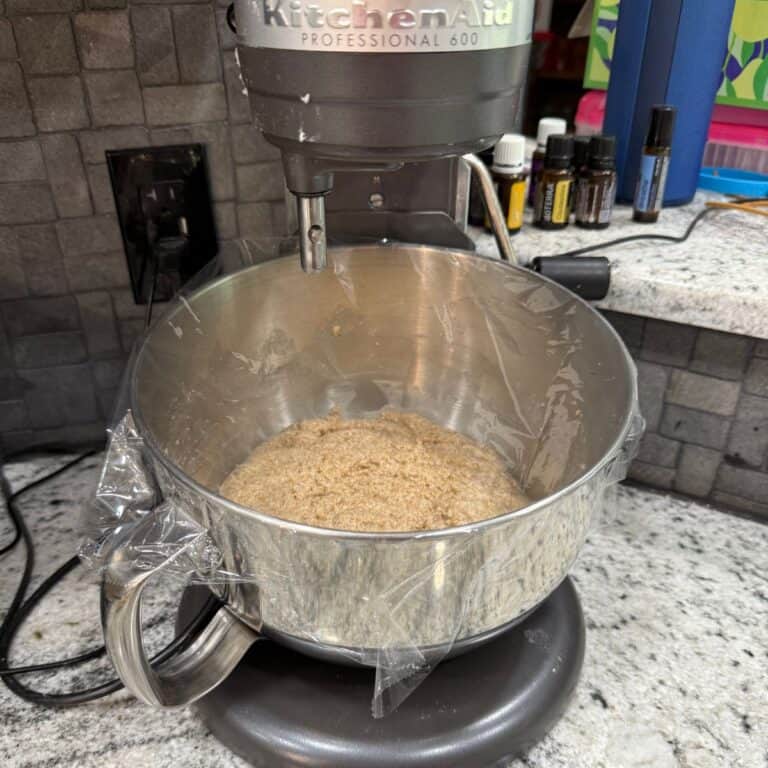 hydrating freshly milled flour mixed with water resting - autolyse - in a kitchen aid mixer on a counter