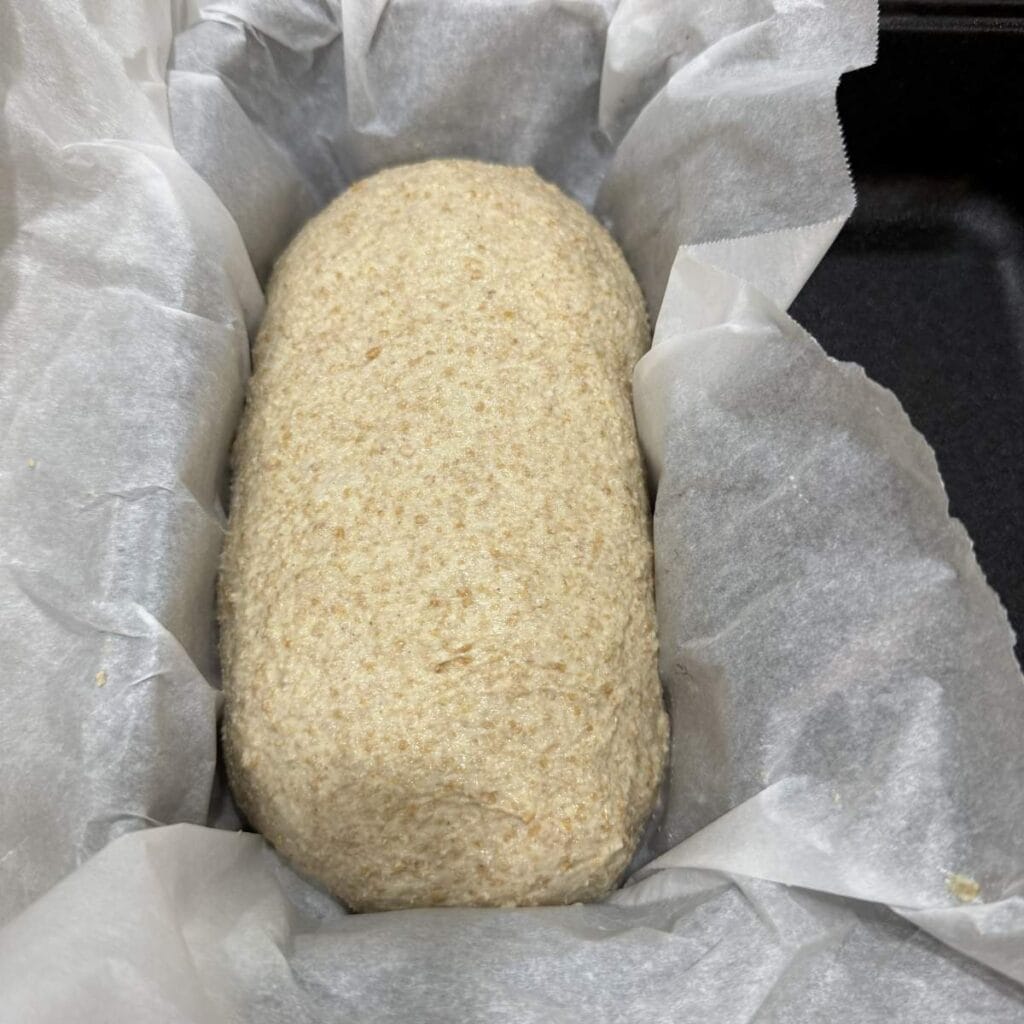 Spelt Sourdough in parchment paper lined pan